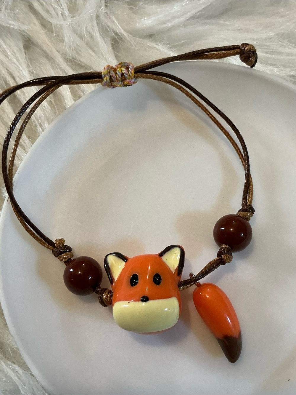Orange/white fox bead brown string adjustable bracelet